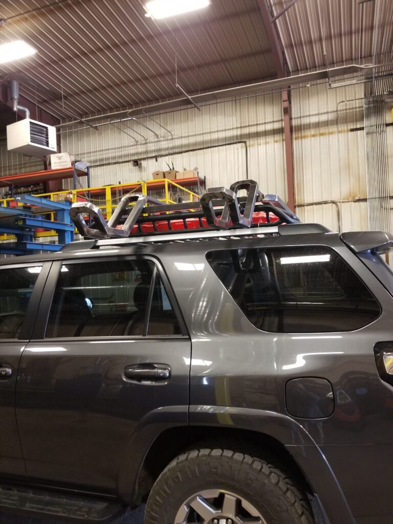 Hood topper made from metal on top of car