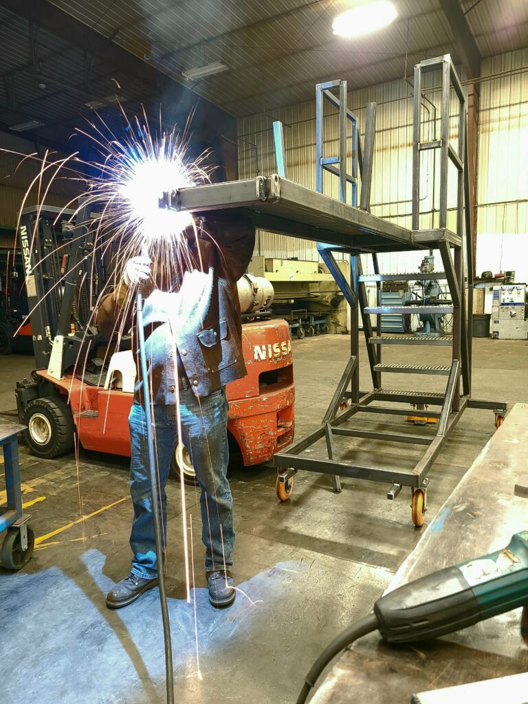 Welder building metal stairs